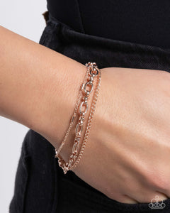 Paparazzi "Chained Celebration - Rose Gold Paparazzi Jewelry